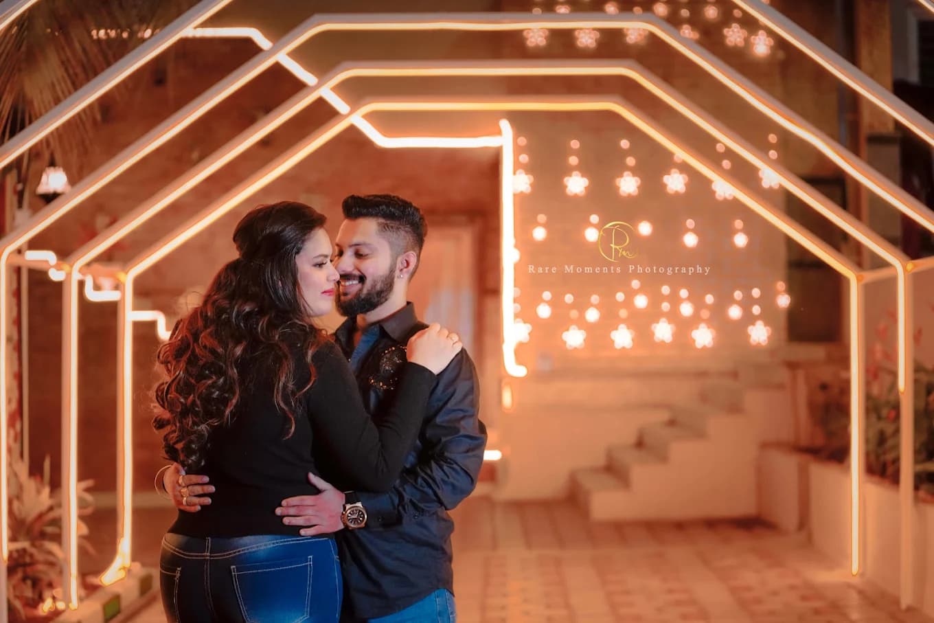 Couple illuminated archway embrace